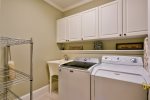 Fully Equipped Kitchen Features Gas Range, Double Ovens, and Bar Seating for 3